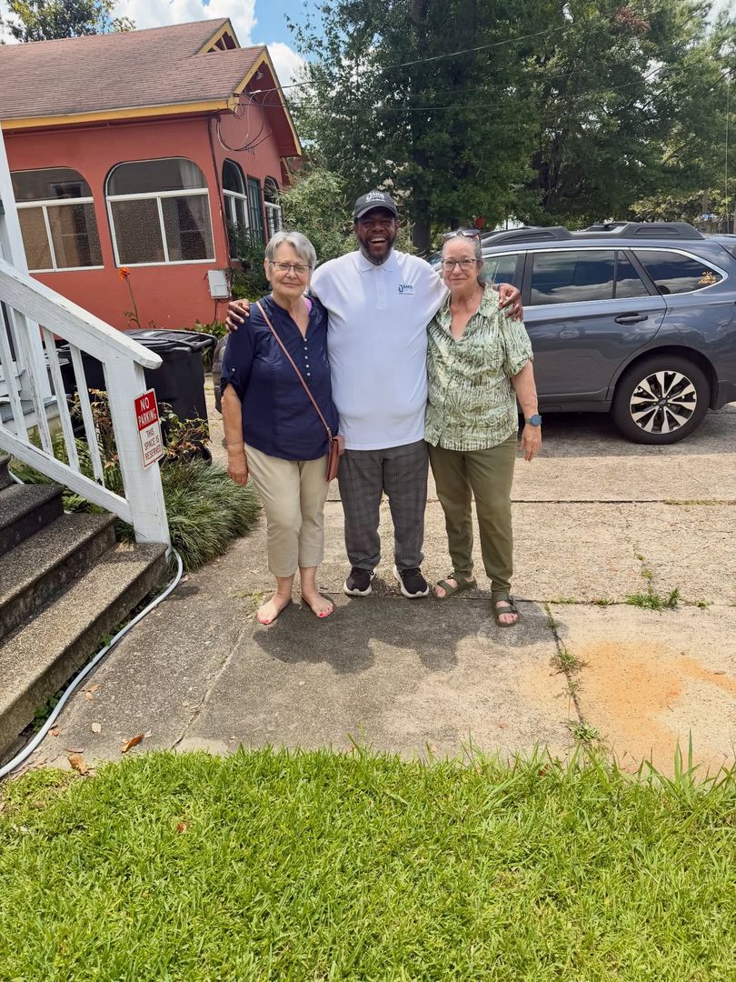 Jamie Davis with supporters outside a Louisiana home