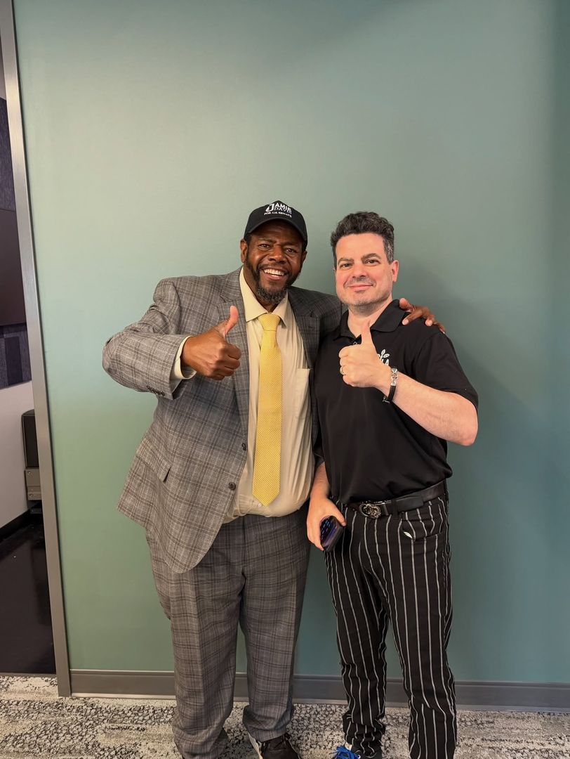 Jamie Davis giving a thumbs-up with a supporter